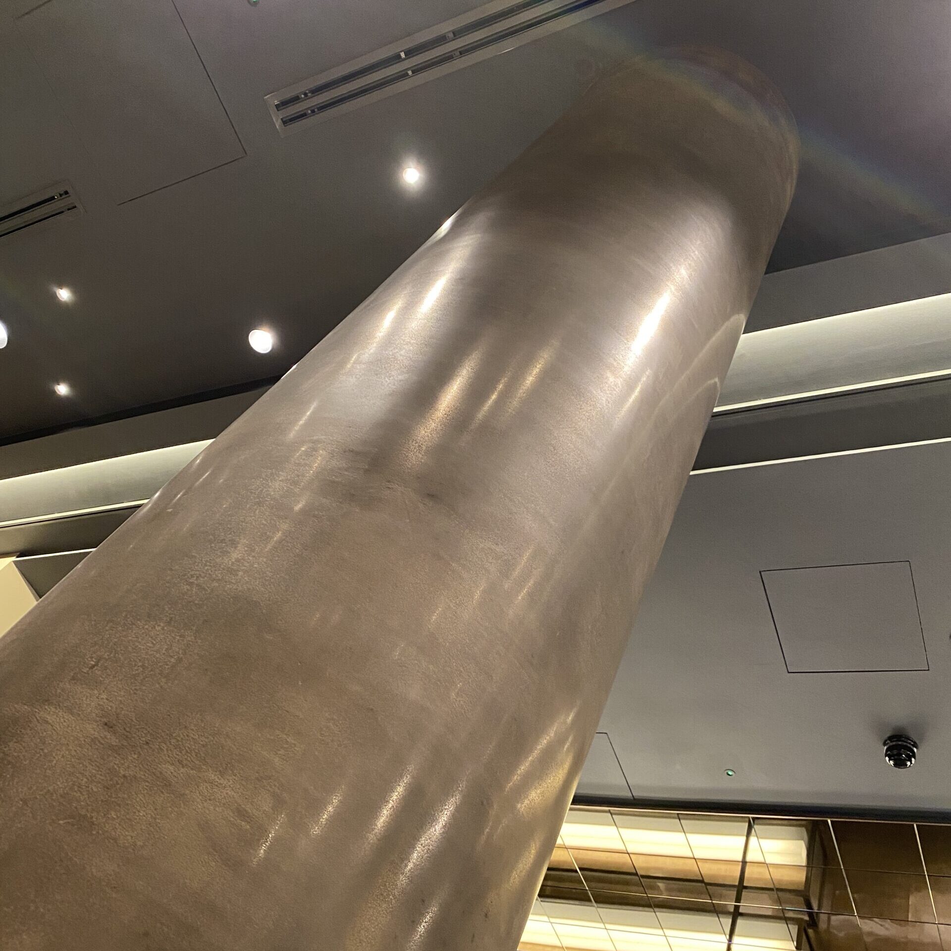 Antique Bronze Liquid Metal pillar, Hilton Hotel Shoreditch