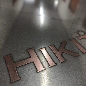 copper logo on tin, liquid metal